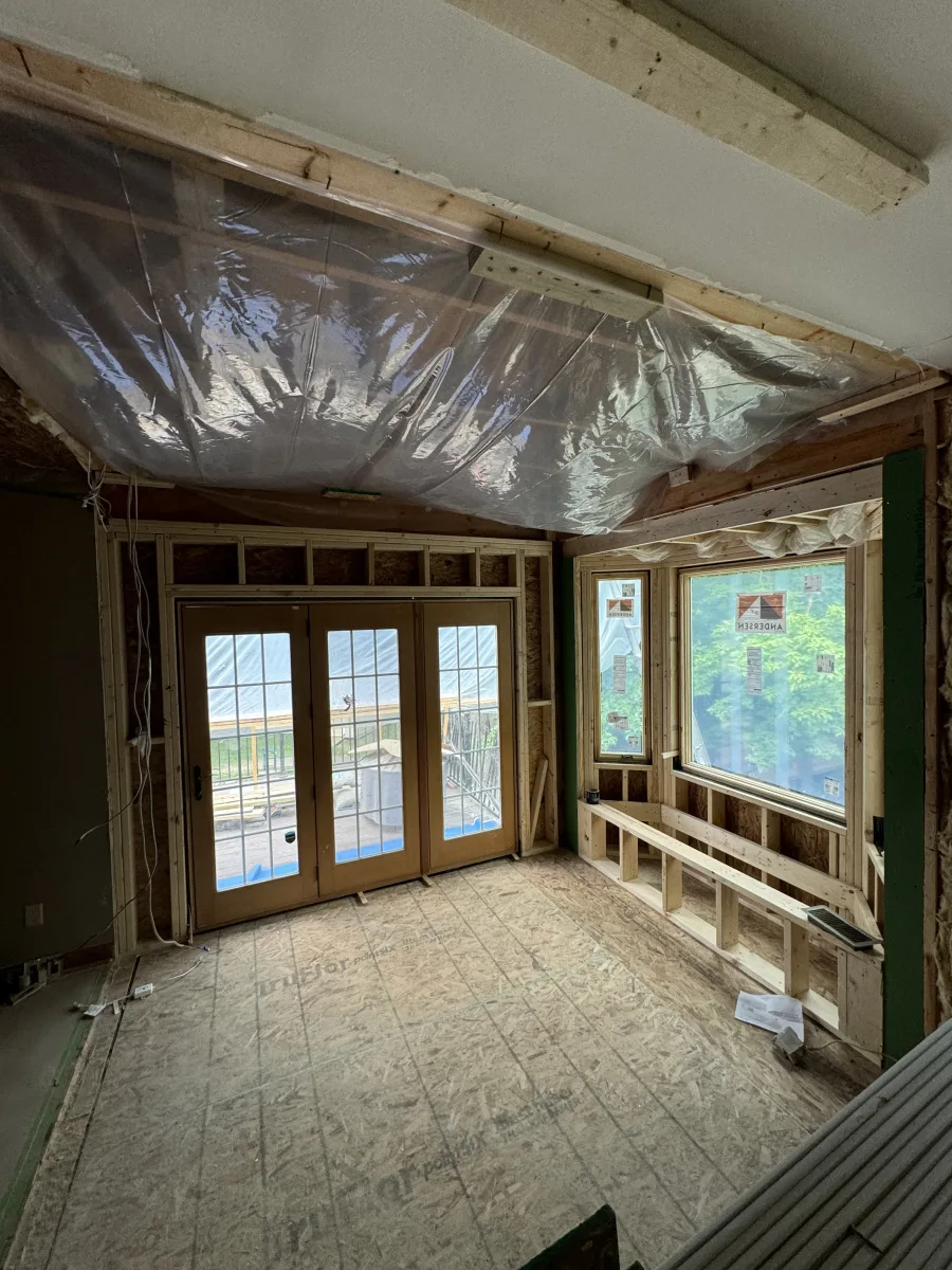 Columbus 2 Story Addition framing, new French doors, bay windows, and built-in bench under construction. Exterior remodeling by 614 Remodeling Pros.