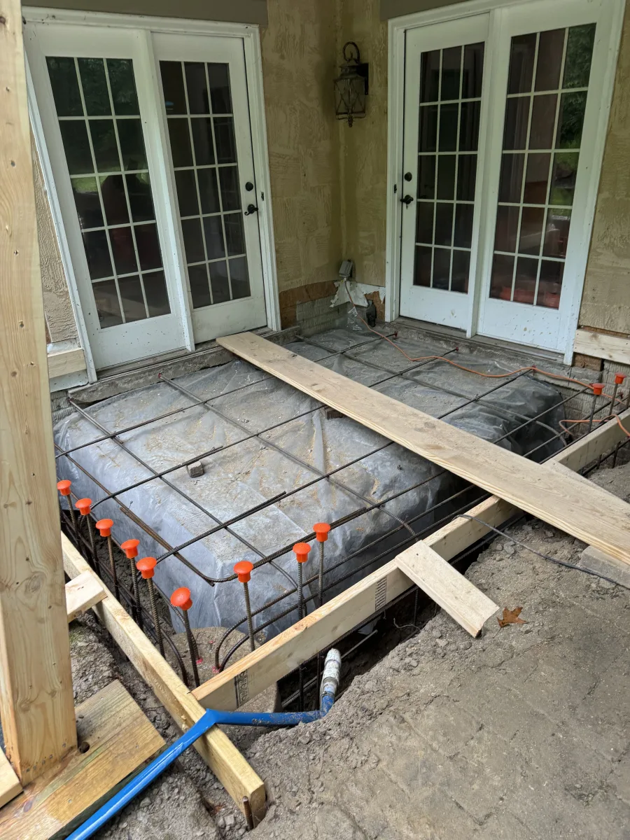 Columbus 2 Story Addition foundation in progress: rebar, formwork, vapor barrier. Expert exterior remodeling by 614 Remodeling Pros.