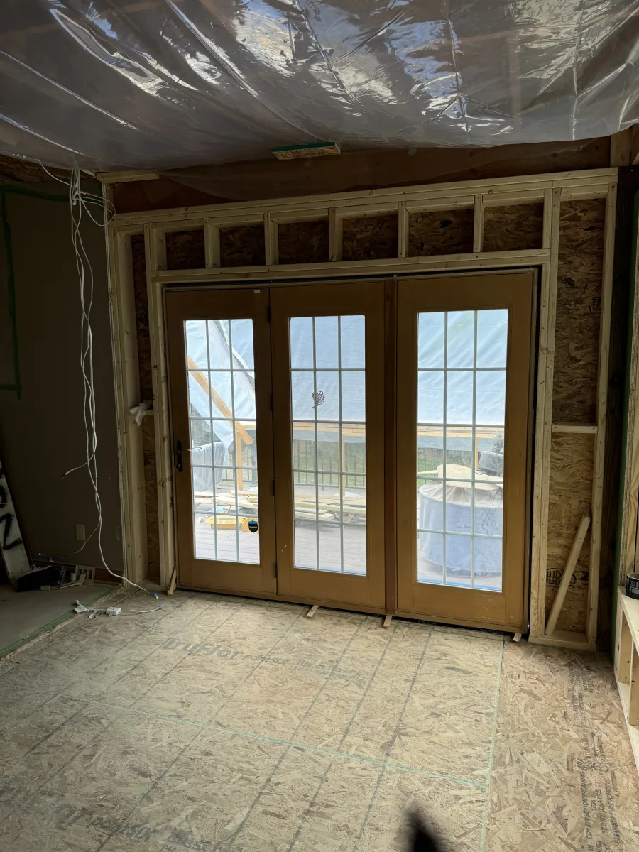 Columbus 2-story addition by 614 Remodeling Pros: New French doors with grilles in wood framing, OSB subfloor.