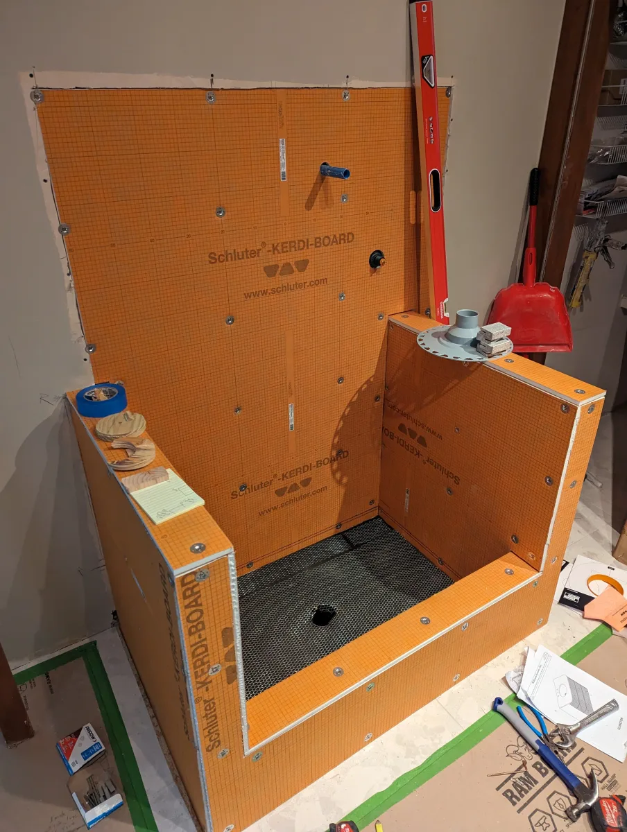 Columbus dog bathing station bathroom remodel in progress, showing orange Schluter-KERDI-BOARD waterproofing for custom build.