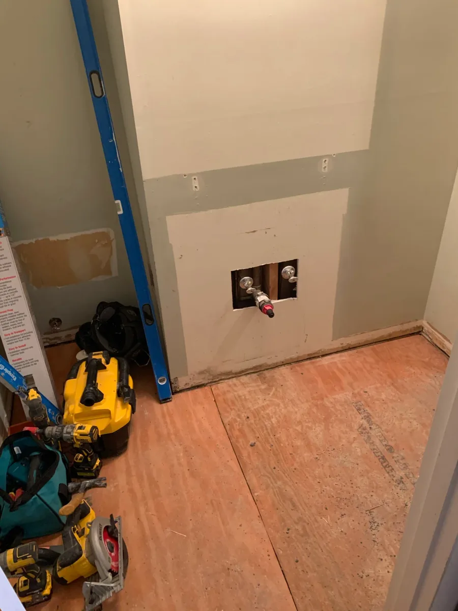 Columbus master bath tile prep: exposed subfloor & plumbing for new shower. 614 Remodeling Pros.
