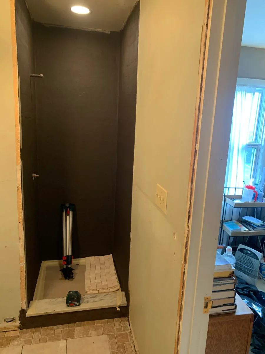 Columbus master bath shower remodel, showing waterproofed walls, new shower pan, and tile prep by 614 Remodeling Pros.