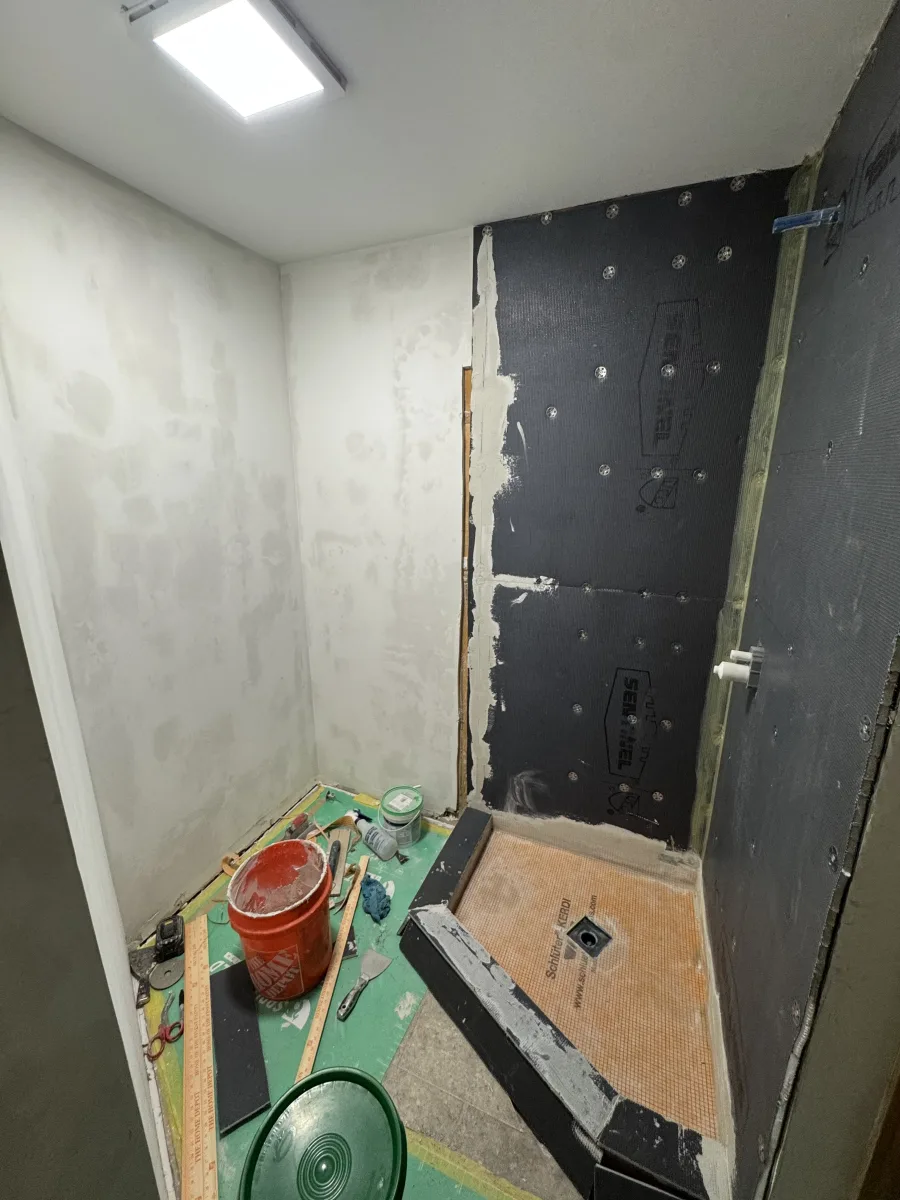 Columbus bathroom remodel in progress: Kerdi waterproof shower, pan installation, and drywall prep for a modern transformation.